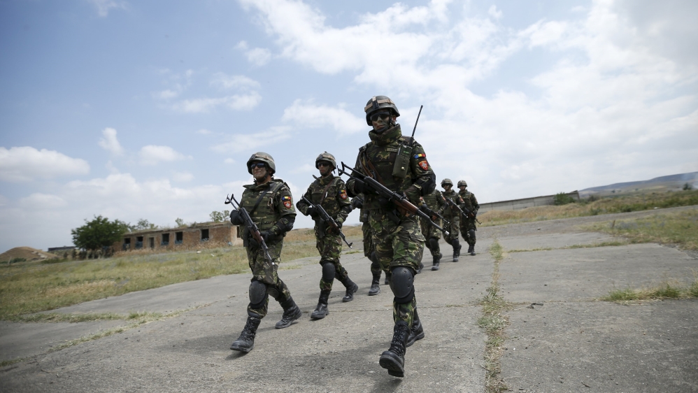 Romanian soldiers march during a joint military exercise with NATO members, called "Agile Spirit 2015" at the Vaziani military base outside Tbilisi