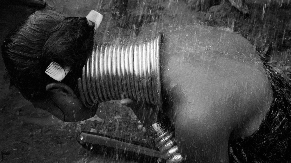 At the end of the day bathing in the river is followed by swimming. It seems like an idyllic life, except for the fact that the Padong people in Nai Soi village have no freedom of movement and are not allowed to leave the border village [Jack Picone]