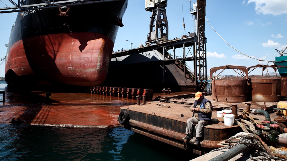 A man fishes in the port [Menelaos Myrillas/SOOC]