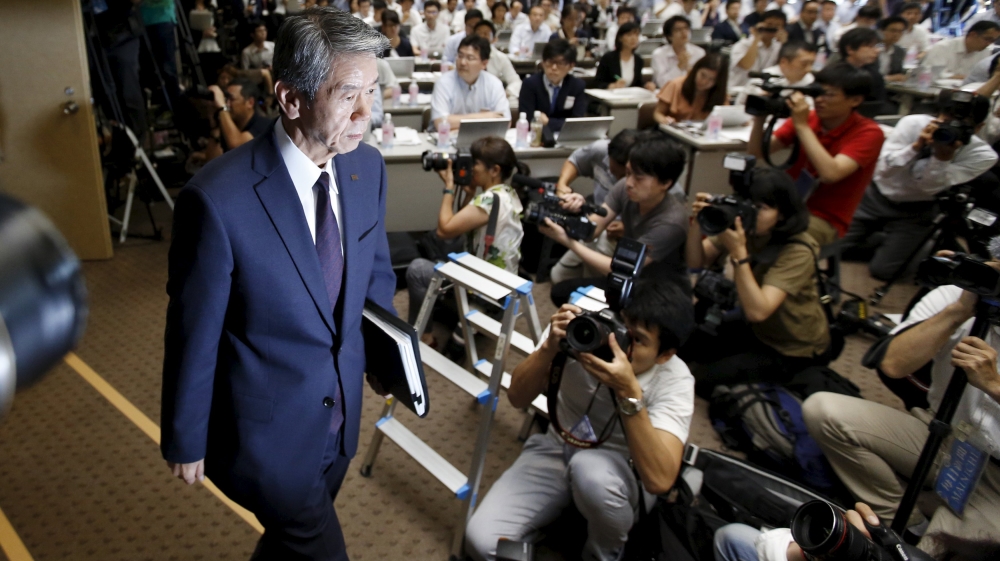 Toshiba Corp President and Chief Executive Officer Hisao Tanaka arrives for a news conference at the company headquarters in Tokyo