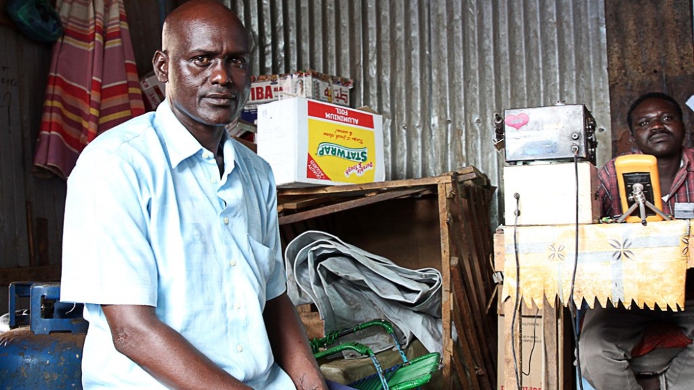 Salah Lumeri Lumja was forced to shut his mobile phone shop in Juba after customers could no longer afford rising prices [Simona Foltyn/Al Jazeera]