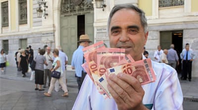 Greek banks have imposed a $66 daily withdrawal limit [ Spyros Tsakiris/ The Associated Press]