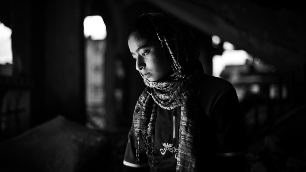 Shady's oldest child, Nour, is 13 years old. She has witnessed three wars during her lifetime, but her father says last summer's conflict was the worst she has experienced. She still wakes up screaming at night [Virginie Nguyen Hoang/Hanslucas/Collectif Huma] 