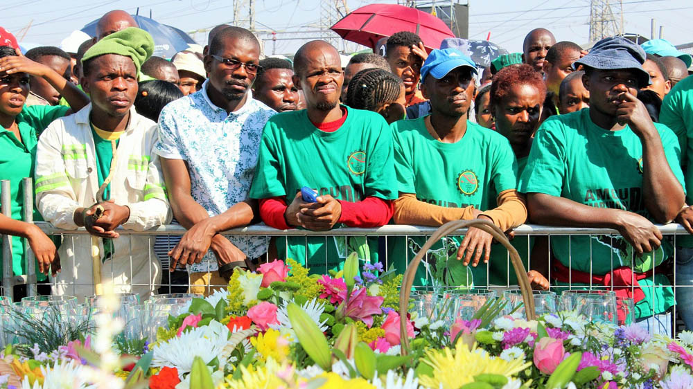 Crowds gathered on the kopje where some of the miners were shot to pay tribute during anniversary commemorations [Tendai Marima/Al Jazeera]