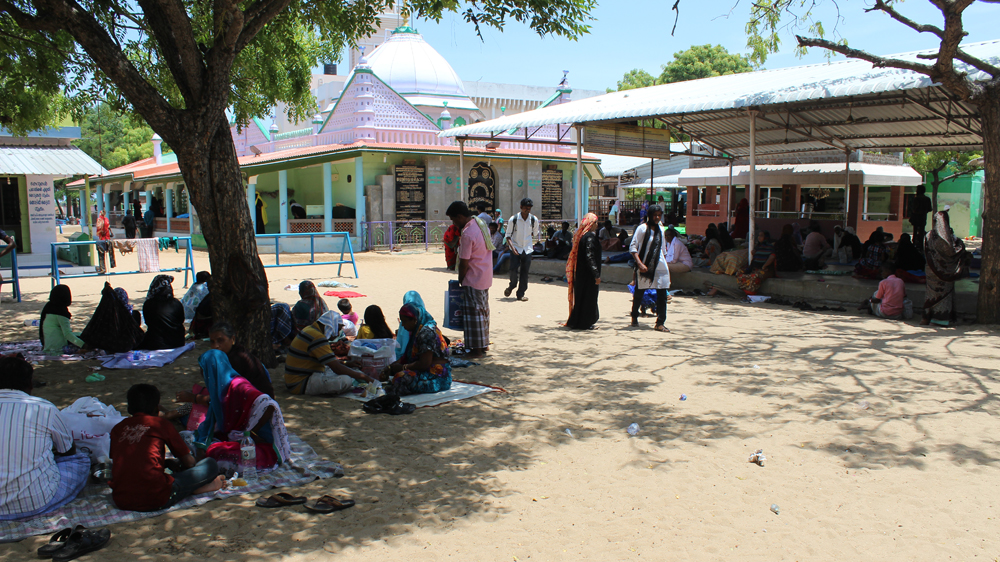Relatives pray for a cure for their mentally ill family members inside Erwadi Dargah [Sandhya Ravishankar/Al Jazeera] 