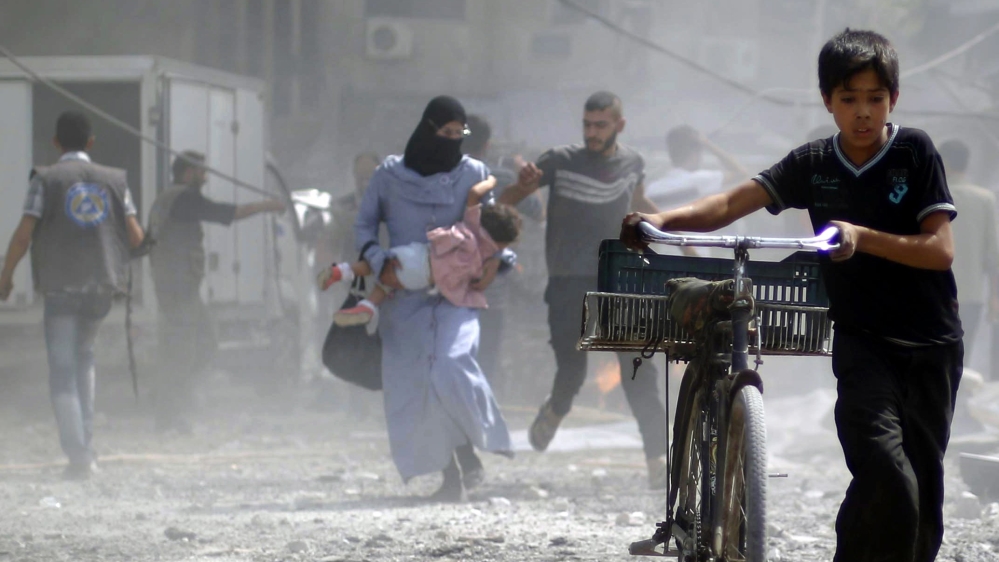 'The entire world is watching Syrian children and women being killed by barrel bombs and air strikes' [AFP]