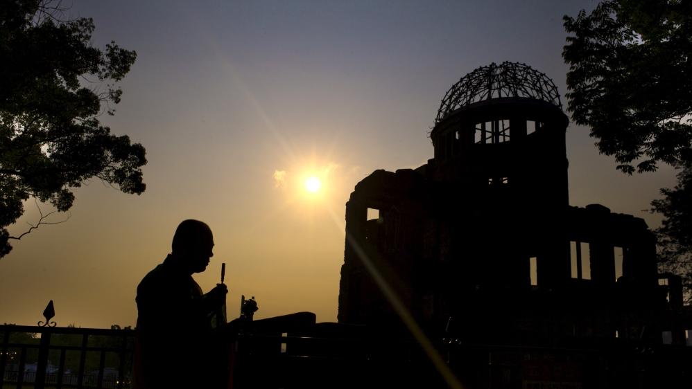 Buddhist monk performs ritual movements during video shoot in Hiroshima