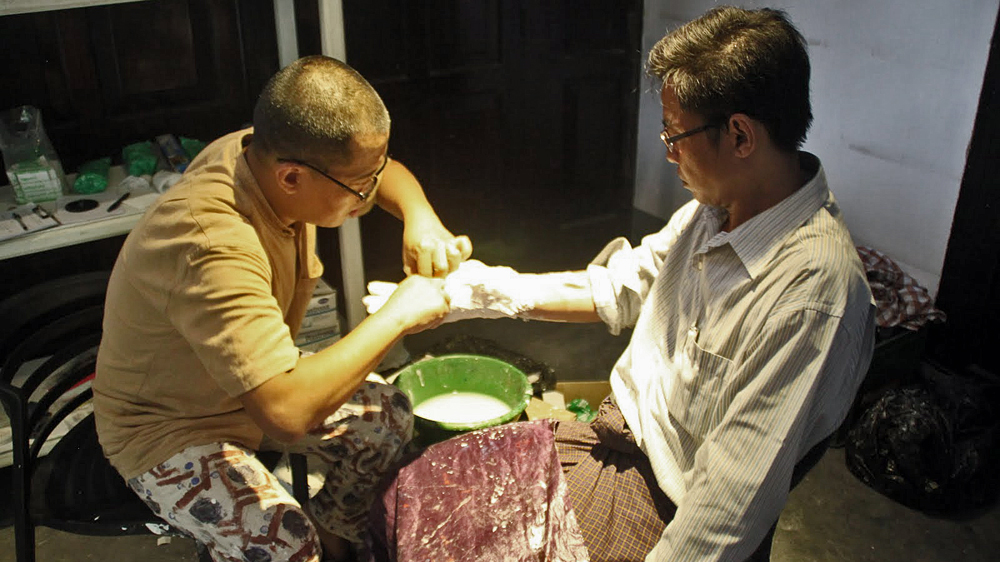 The artist aims to collect 1,000 hand casts from former political prisoners [Mark Fenn/Al Jazeera]