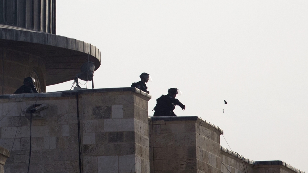 Clashes continued outside the mosque complex, with police firing tear gas and stun grenades [EPA]
