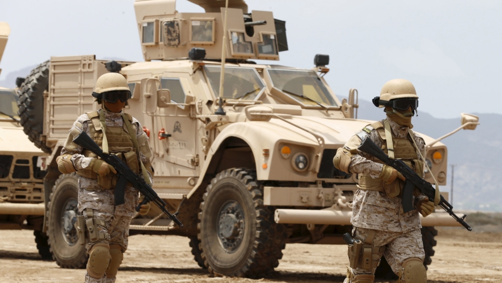 Saudi troops walk at their base in Yemen''s southern port city of Aden