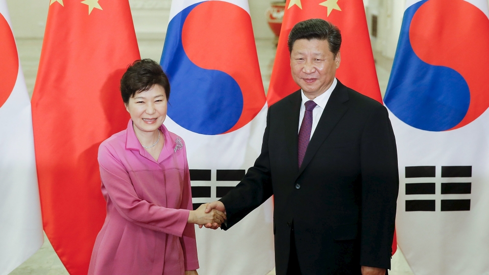 Chinese President Xi Jinping shakes hands with South Korean President Park Geun-hye at The Great Hall Of The People in Beijing, China [REUTERS]