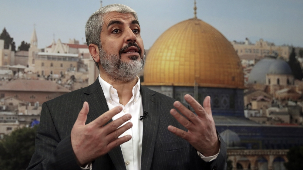 Hamas leader Khaled Meshaal speaks during an interview with Reuters in Doha