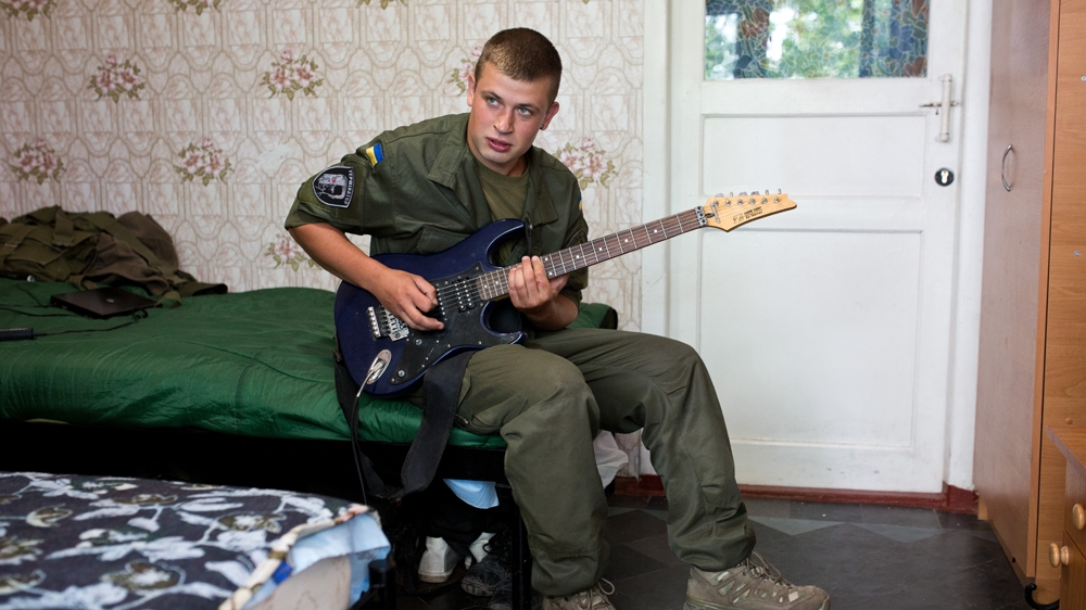 Nikrasov has been playing guitar since he was 10 years old and keeps his instrument at the base so that he can play it from time to time [Virginie NGUYEN HOANG] 