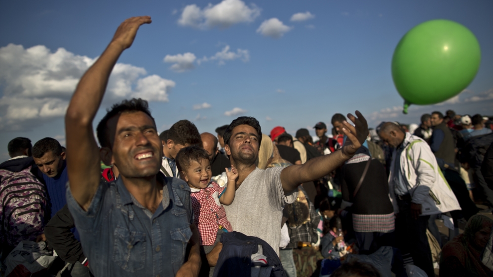 Germany has so far taken the lion's share of refugees, admitting 450,000 people this year, including many from Afghanistan [AP]