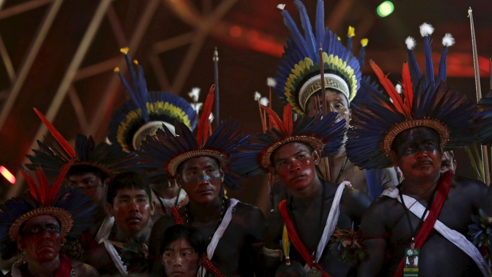Indigenous people of several tribes watch a presentation by Indigenous people from Kuikuro before the I World Games for Indigenous People in Palmas