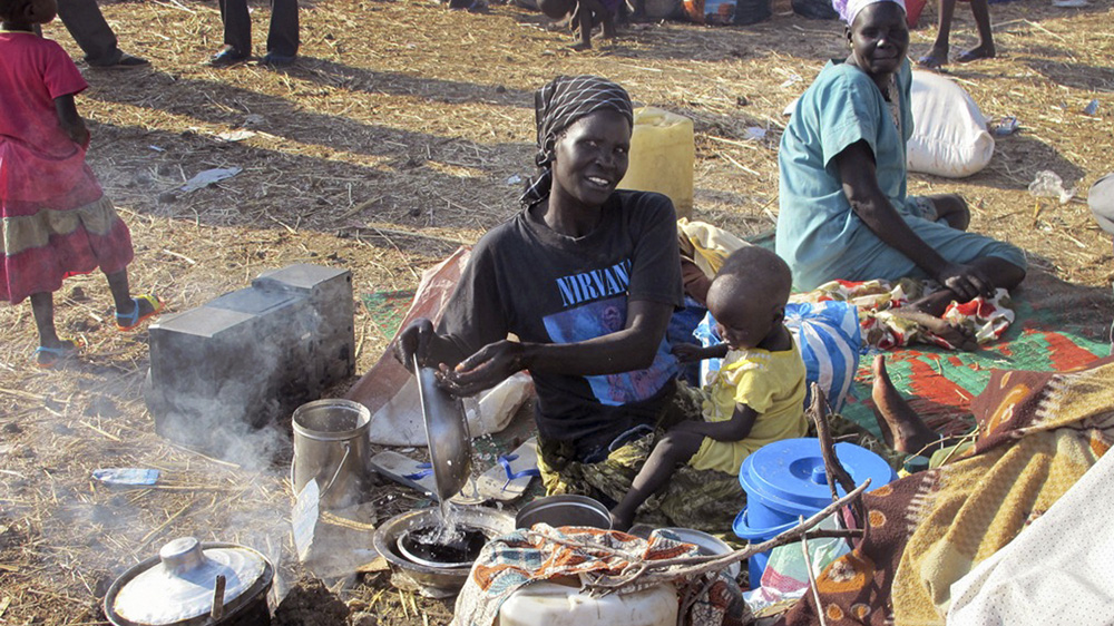 Displaced people who take shelter in the UN compound say the food aid they receive is insufficient for survival [Anna Adhikari/UNMISS/AP]