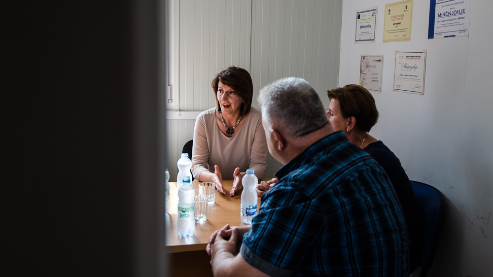 President Jahjaga attends a meeting at an agricultural cooperative in Krushë e Madhe, also known as the village of widows as a result of the massacre that took place here during the Kosovo War [Valerie Plesch/Al Jazeera] 