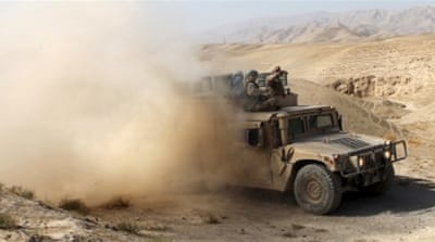 An Afghan security vehicle advances towards the city of Kunduz [Reuters]