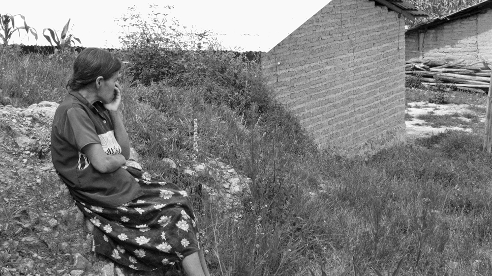 Maurilia's mother watches as an ambulance arrives for her daughter [Prometeo Lucero]