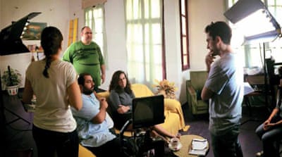 Director Khalil Bitar discusses a scene with his actors [Lynn Dagher/Al Jazeera]