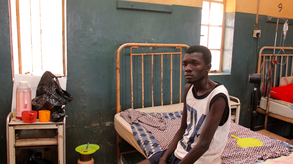 Painter Mohammed Abdullahi is recovering in Yola's State Specialist Hospital. Shrapnel from the blast entered his stomach [Femke van Zeijl/Al Jazeera] 