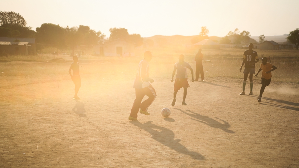 Children play football in the evening in Gyero village, Jos [Enoch Shaibu/Al Jazeera]