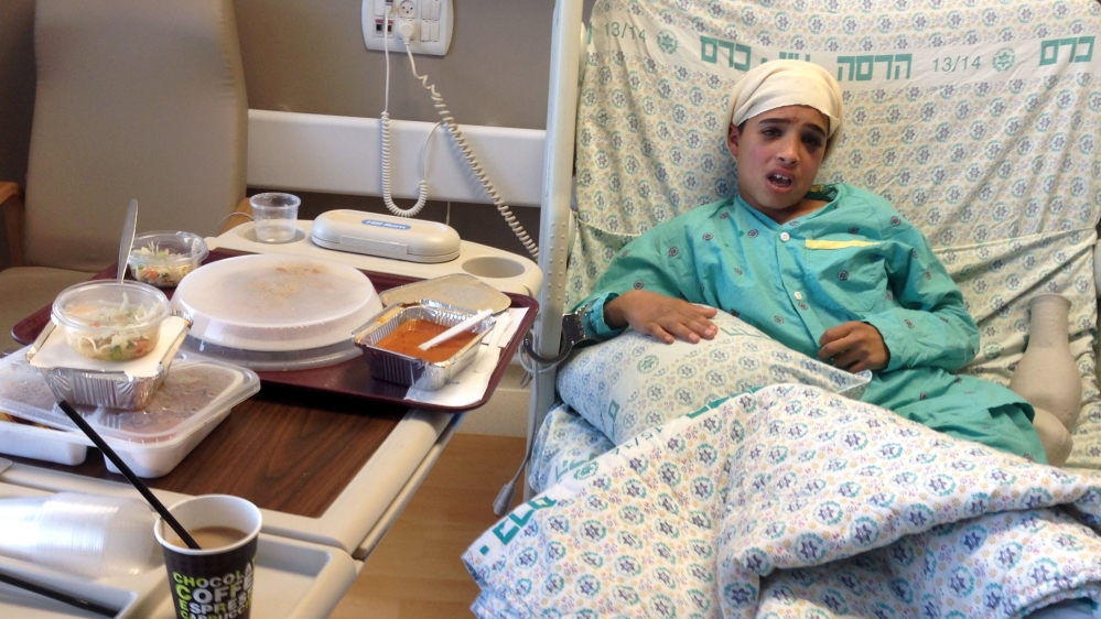 Handout showing Manasra sitting handcuffed to his hospital bed in Jerusalem