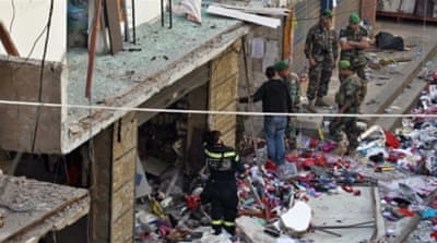 Lebanese army soldiers stand guard at the scene of the twin suicide bombings in Burj al-Barajneh, southern Beirut [AP]