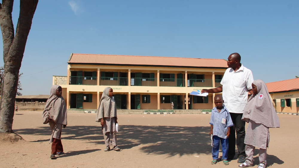Headteacher Abdulmalik Yakubu in the yard of the Doubeli Primary School in Jimeta. Six of the victims of the November 17 bombing were pupils at the school [Femke van Zeijl/Al Jazeera]