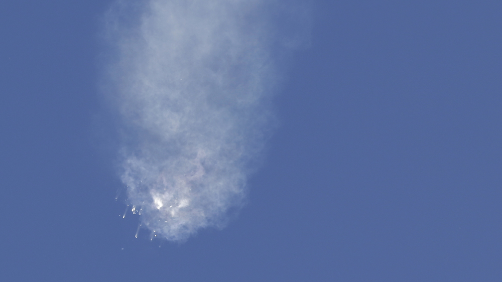 Pieces of the Falcon 9 rocket fell to Earth after the spacecraft broke apart shortly after liftoff [John Raoux/AP]