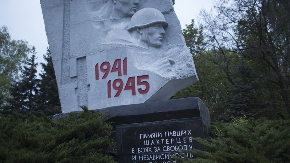 This monument in Shakhtiorsk is dedicated to the miners who died fighting in World War II, which in Russia is known as the Great Patriotic War. The victory over Nazi Germany, and the enormous sacrifices that accompanied it, are still central to the identity of the people of Donbass. [Janos Chiala and Tali Mayer/Al Jazeera] 
