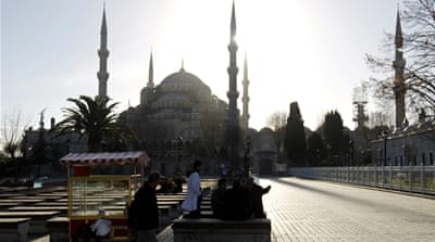 People sit in front of Blue Mosque after an explosion near the Mosque in the Sultanahmet district of central Istanbul [EPA]