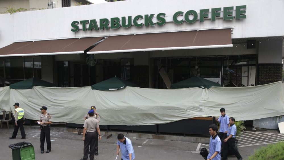 The attacker began shooting at a Starbucks coffee house near the capital's business district [Tatan Syuflana/AP]