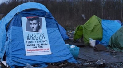 A Justin Bieber poster on one of the tents [Lydia Noon/Al Jazeera]