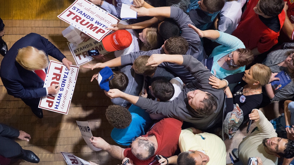 Republican presidential candidate Donald Trump greets guests after speaking at a campaign rally in Burlington, Iowa [Scott Olson/Getty Images]