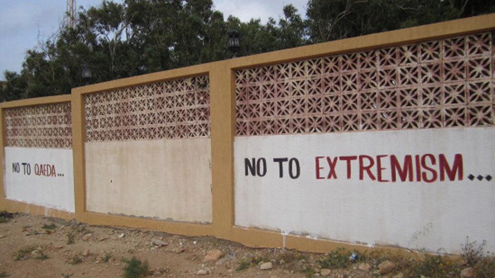 Libya is trying to fight a reputation of being fertile ground for al-Qaeda through signs like this painted outside a media centre [Getty]