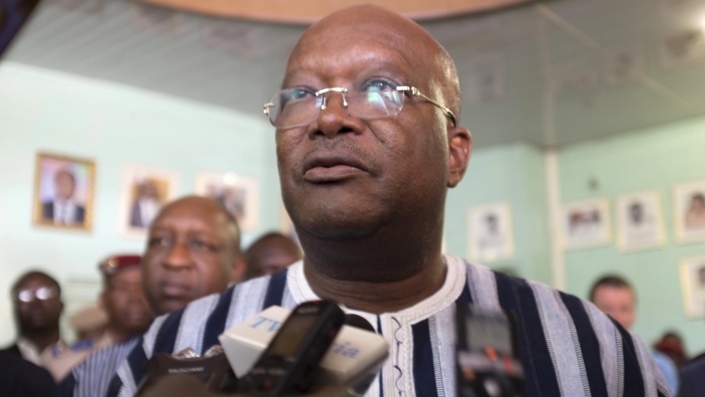 President Kabore speaks to journalists at the site of the attack in Ouagadougou on Saturday [Reuters]