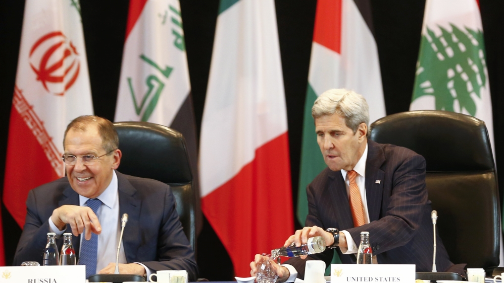 Lavrov, left, said that Russia will continue its air strikes against Syrian armed groups opposing Assad's government [AP]