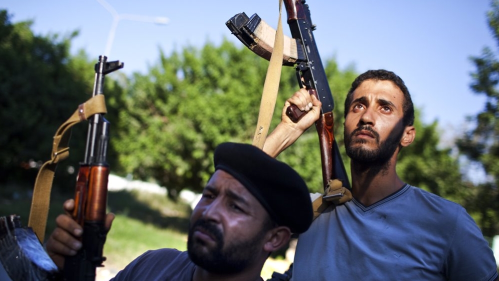 The number of fighters during the revolution was around 25,000, yet after the liberation, this number mushroomed tenfold [Getty]