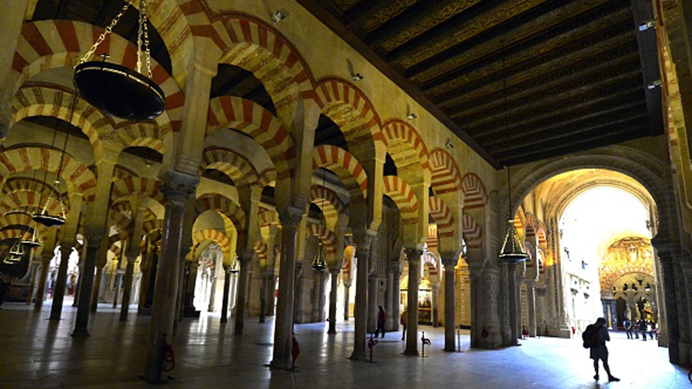 A tourist visits in the Mosque-Cathedral of Cordoba [AFP]