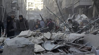 Residents inspect damage after air strikes in the rebel held al-Shaar neighborhood of Aleppo[Abdalrhman Ismail/Reuters]