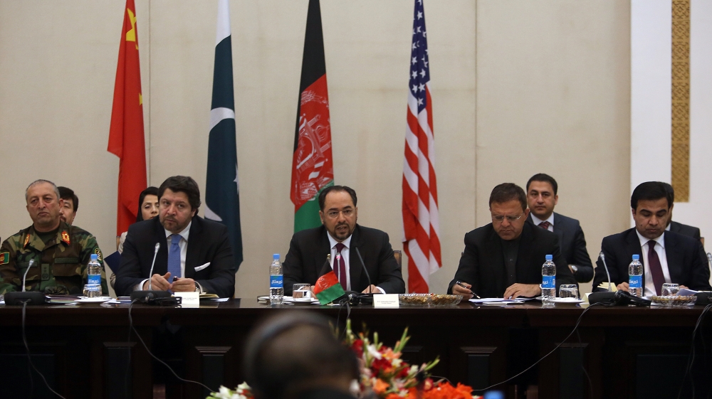 Afghan Foreign Minister, Salahuddin Rabbani, center, starts the meeting to discus a road map for ending the war with the Taliban