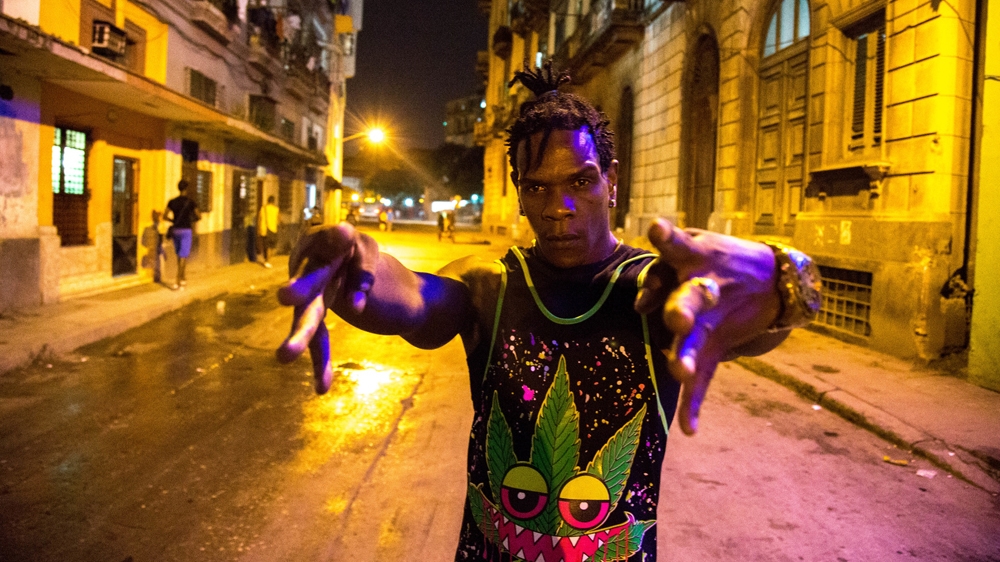 Faraon outside the Asphalt Jungle freestyles 'No respire que te muere!' [Don't breathe or you're dead] - a reference to his full-frontal assault-style of rapping [Tomas Ayuso/Al Jazeera]