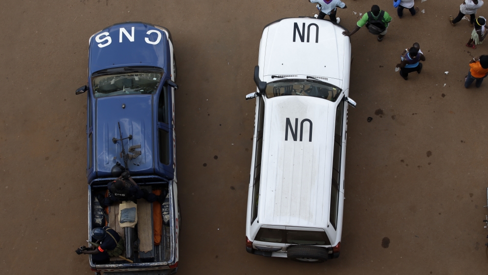A police and a U.N. vehicles enforce security outside the Barthelemy Boganda Stadium, in Bangui, Central African Republic,