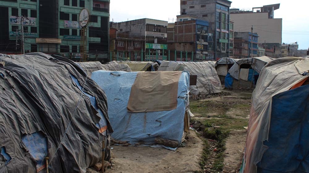 Tents house those who lost their homes in Chuchepati, Kathmandu [Saif Khalid/Al Jazeera]