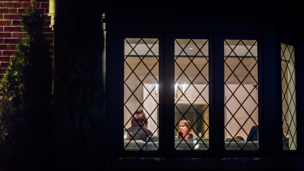 A meeting of Downtown Relief Line, a group of 13 individuals who came together over Facebook to sponsor a Syrian family [Ryan Edwardson/Al Jazeera]