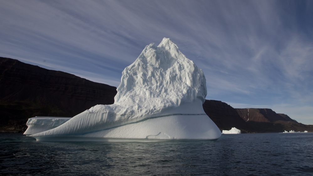 In this July 21, 2011 file photo, an iceberg floats in the sea near Qeqertarsuaq, Disko Island, Greenland.