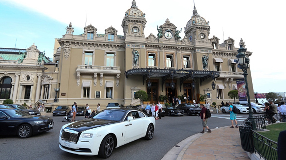 A Rolls-Royce drives in front of the Casino de Monte-Carlo in Monaco [Getty]