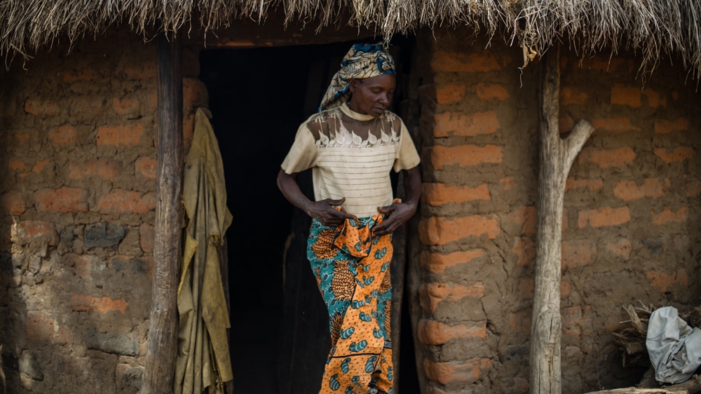 Naomi needs a lot of help around the home as a result of the injuries she sustained at the hands of the colonial soldiers. 'I don't walk properly because of the injuries I got. I feel I was destroyed inside,' she says. They took in young women, one of whom still lives with and cares for the couple [Phil Moore/Al Jazeera]