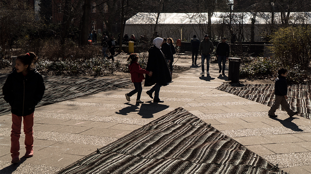 Refugees at State Office for Health and Social Affairs in Berlin [Sorin Furcoi/Al Jazeera]